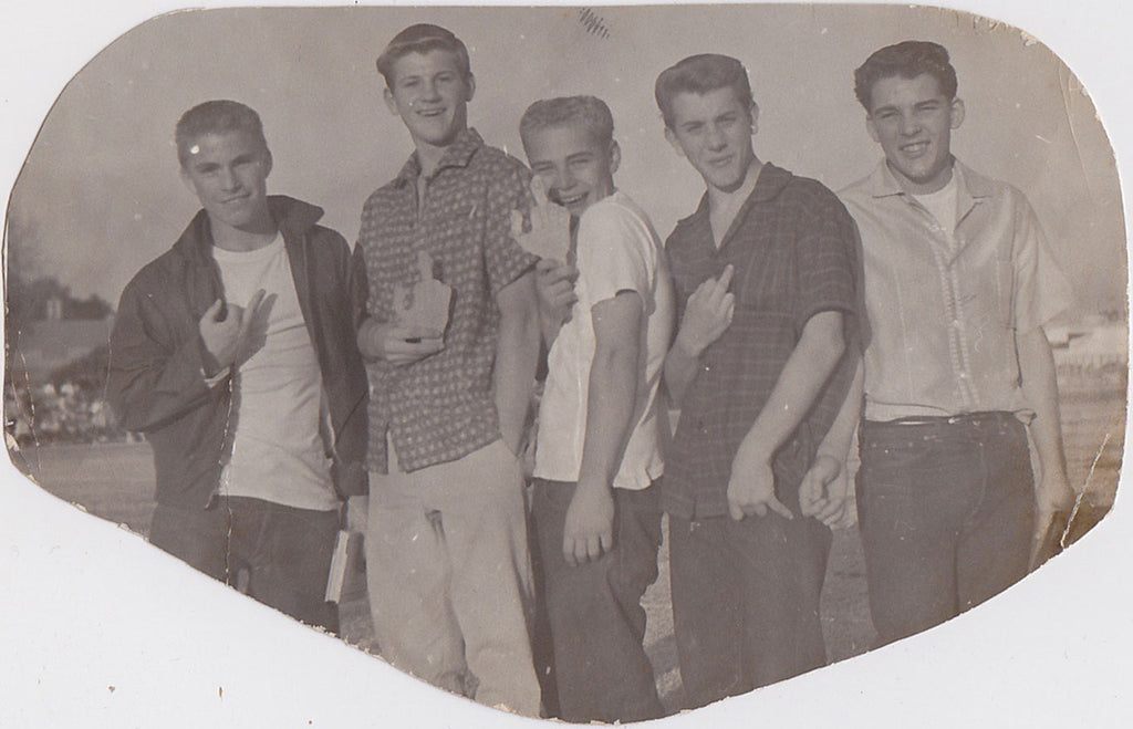 Four of the five young guys are giving the finger to the photographer vintage snapshot