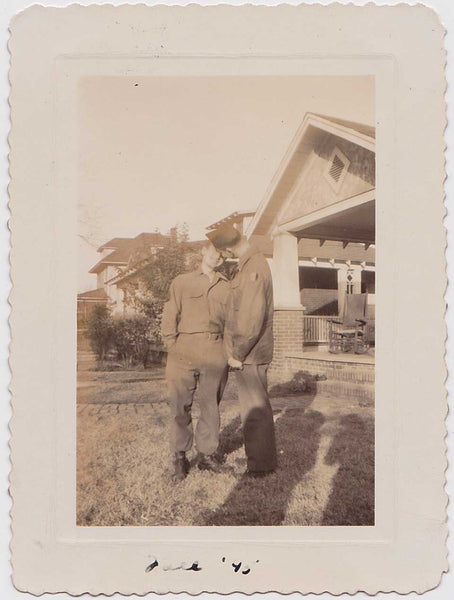 vintage photo of two soldiers seem to on the verge of kissing