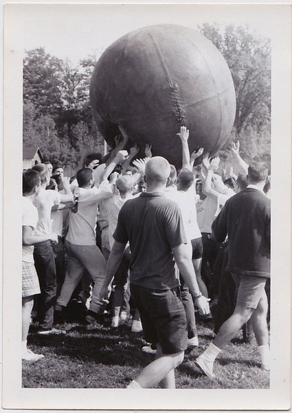 Men Pushing a Giant Leather Ball vintage snapshot