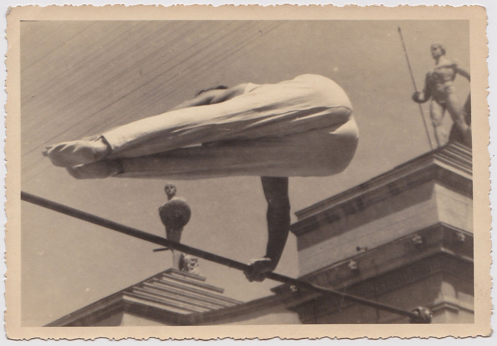Anonymous vintage photo of a gymnast seen from below.