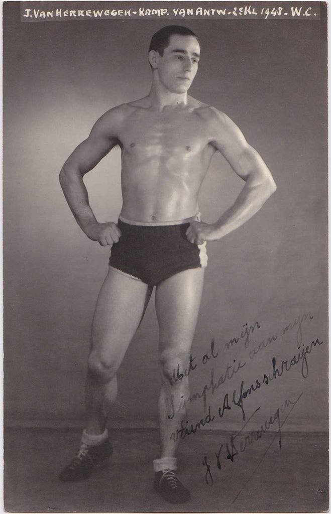 Handsome, lightly oiled athlete poses in the studio vintage real photo postcard