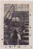 Two doughboys snuggle on the steps vintage gay photo
