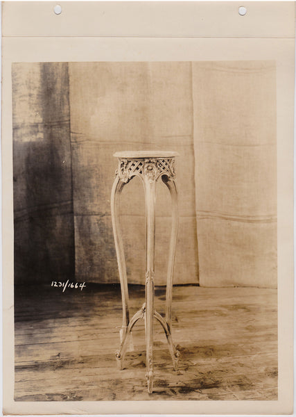 vintage sepia photo Elegant table/plant stand rests lightly on the wood floor, almost like a dancer en pointe.