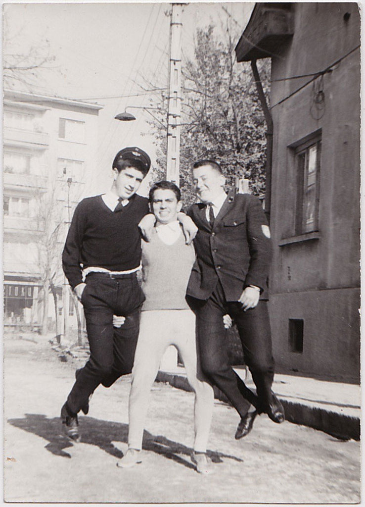 Man Lifting Two Bigger Men vintage snapshot