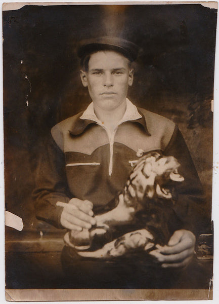 Strange portrait of a handsome Russian wearing a top hat vintage sepia photo