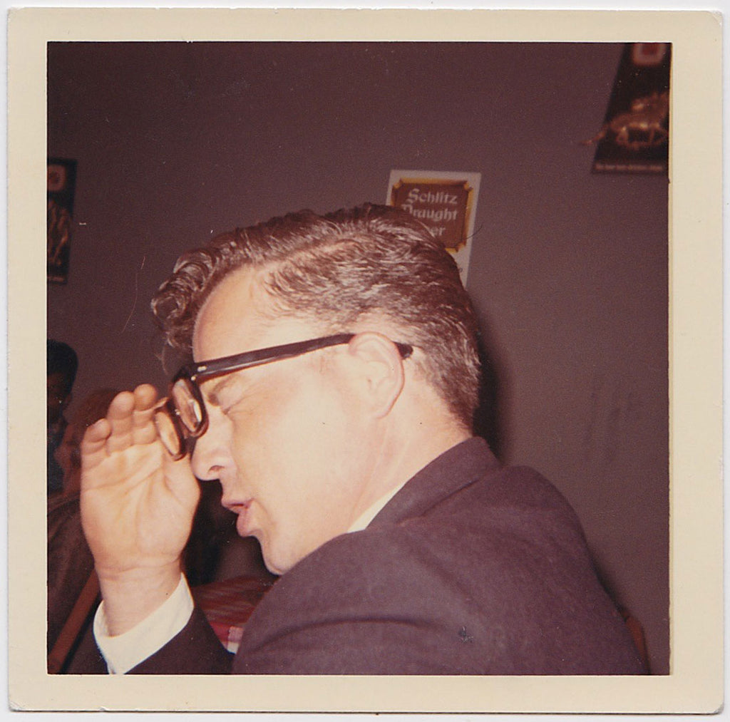 Weary Man Taking Off Glasses vintage color photo