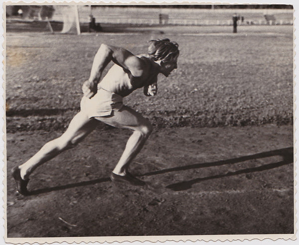 Athlete captured doing a sprint at practice vintage snapshot