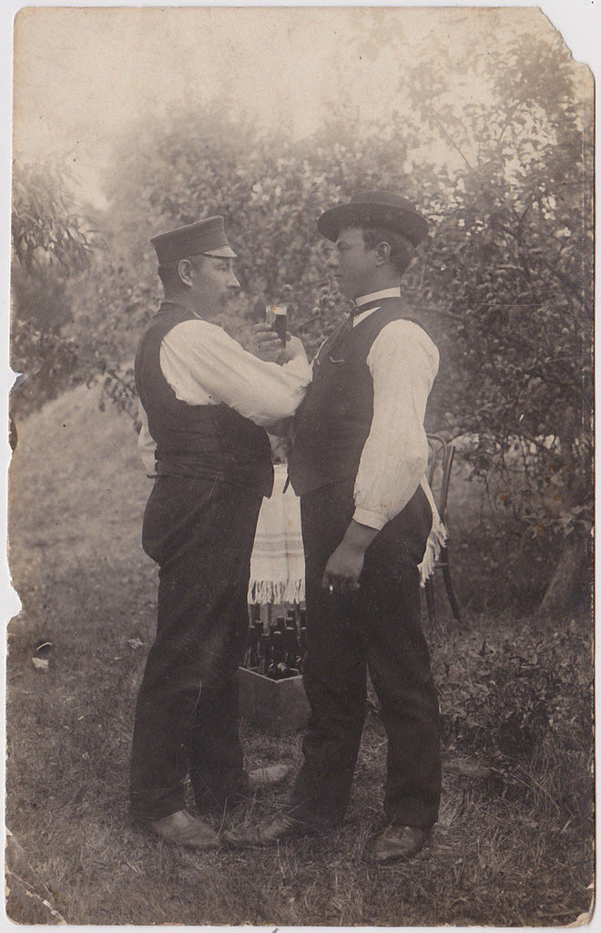 Affectionate Men Toasting: Real Photo Postcard