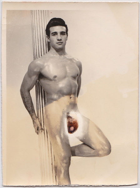 This photo, attributed to Lon of NY, is of handsome model Reno Vance leaning against a column vintage physique photo.