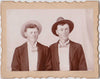 Two young men dressed-up with fancy ties and hats for their studio portrait. Identified on verso