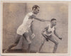 action shot of two handsome athletes wearing tight short shorts on the squash court. vintage photo