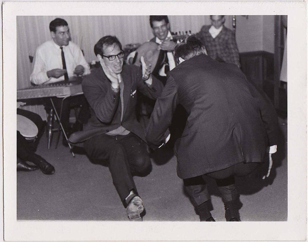 Two enthusiastic men dance together vintage photo