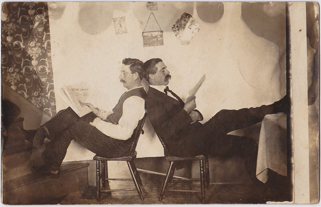 Two Men Reading Newspapers