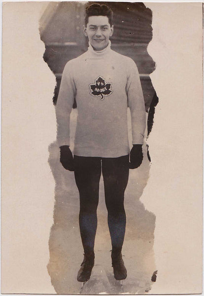 Vintage real photo postcard Handsome ice skater with massive legs. 