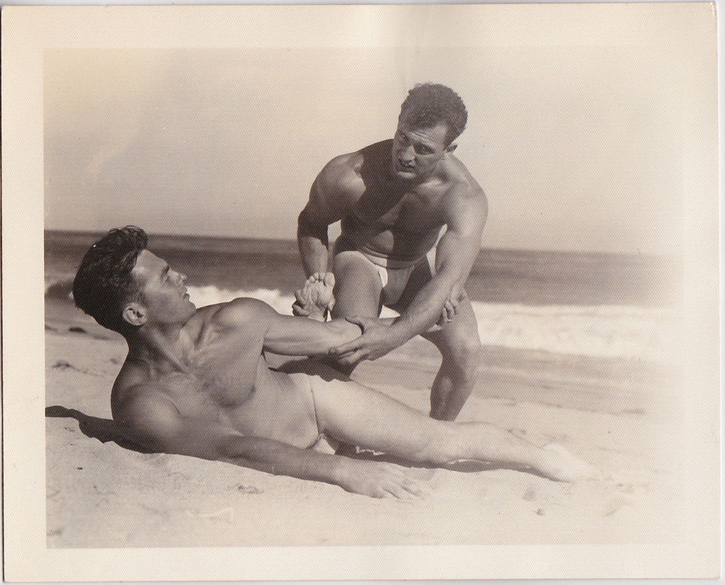 Muscular wrestlers on beach, vintage photo Bruce of LA