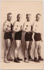 Vintage sepia Real Photo Postcard of a wrestling team. 